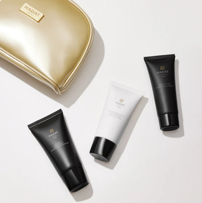 Hadat cosmetics Hydro Nourishing Kit – plaukus maitinantis, drėkinantis rinkinys su kosmetine